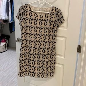 Black and Cream DKNYC dress with capped sleeves.